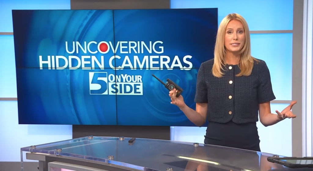 Woman on news explaining how to find hidden cameras in rooms