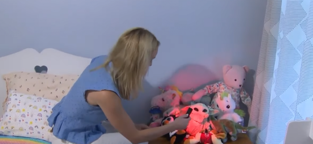 Woman detecting hidden camera in stuffed animals